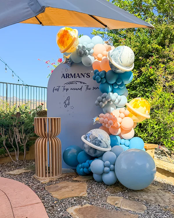 Arman's 1st Birthday — Space Adventure — Birthday backdrop and garland in Porter Ranch