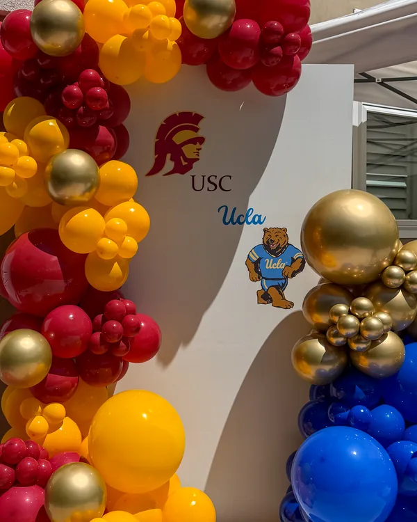 USC × UCLA Dual Graduation — Walnut — Graduation backdrop and garland in Walnut