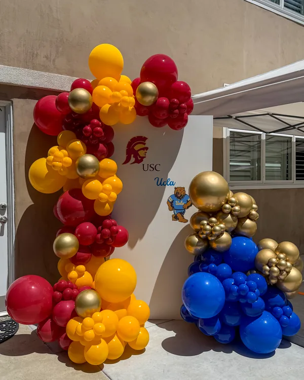 USC × UCLA Dual Graduation — Walnut — Graduation balloon decor detail Walnut