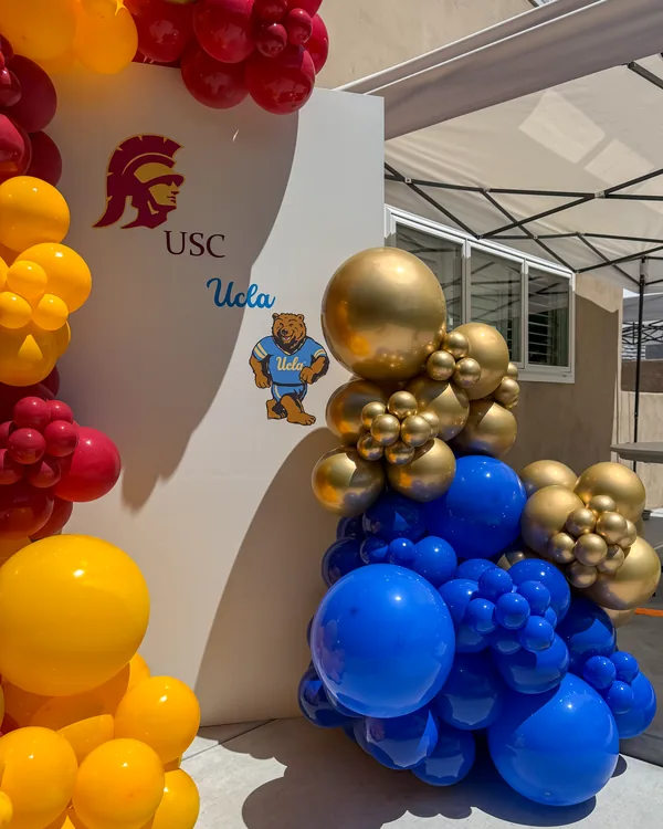 USC × UCLA Dual Graduation — Walnut — Graduation balloon decor detail Walnut