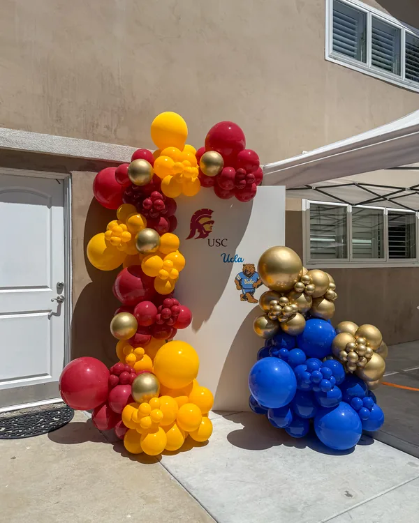 USC × UCLA Dual Graduation — Walnut — Graduation balloon decor detail Walnut